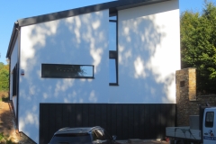 Construction d'une habitation - façade - crépi/panneau noir